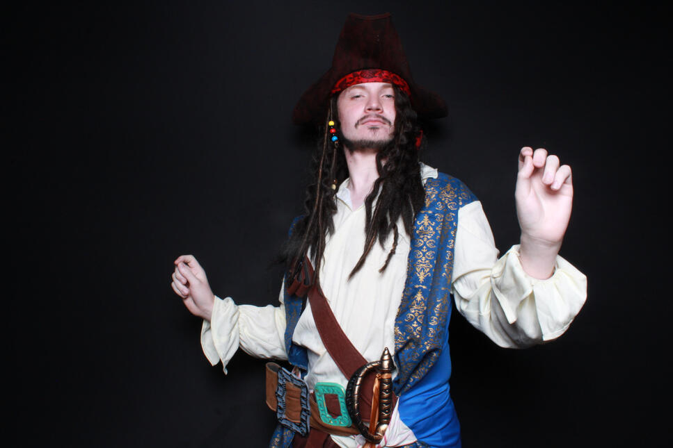 Halloween photo booth, jack sparrow cosplay a man posing for a photo booth photo dressed up as captain jack sparrow for halloween